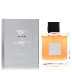 Guerlain L'Homme Ideal Extrème de Guerlain Eau de Parfum, showing the 100ml clear glass bottle filled with amber liquid next to its light gray packaging box.