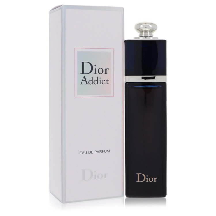 Dior Addict Eau de Parfum bottle in dark navy blue with a silver cap, standing next to its white and pale blue box on a white background.